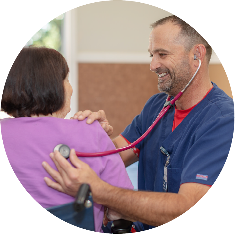 male nurse helping female patient