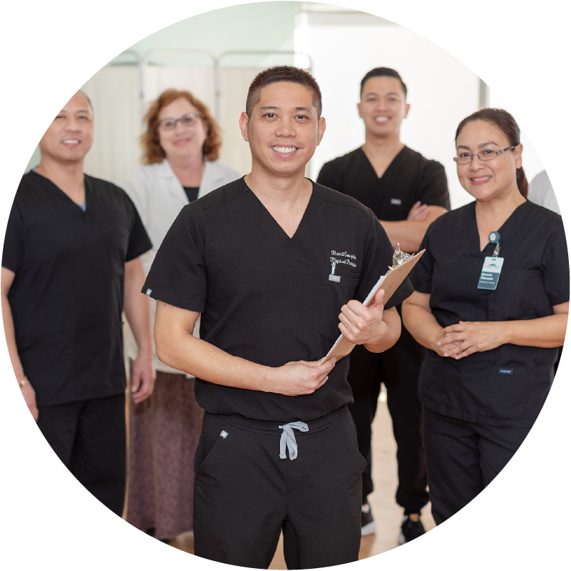 group of clinical workers smiling at the camera