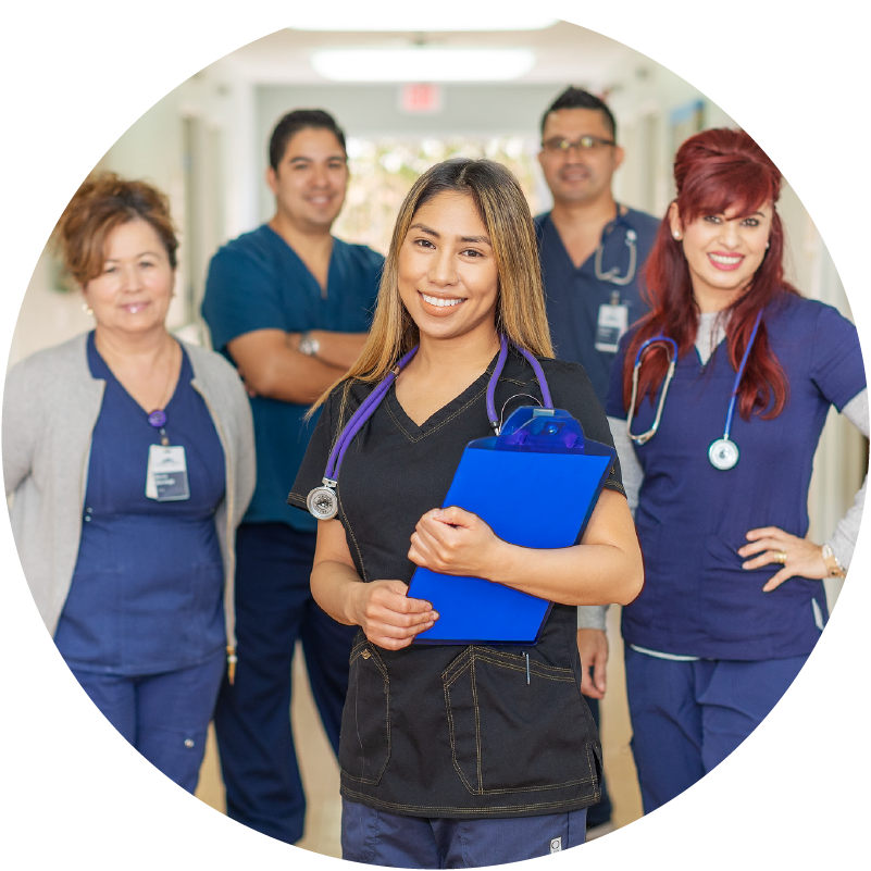 group of clinical workers smiling at the camera